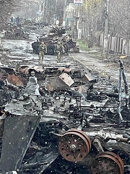 Destroyed Russian armored vehicle illustrating the Russian army recruitment crisis in the Ukraine war