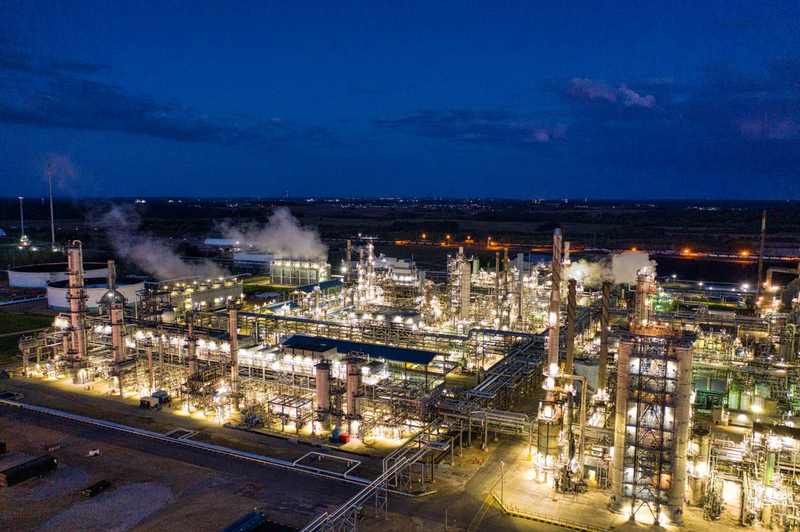 Oil refinery illuminated at night — Lukoil Ukhta refinery drone strike