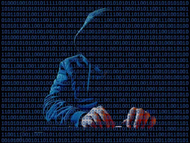 Hooded hacker silhouette against binary code