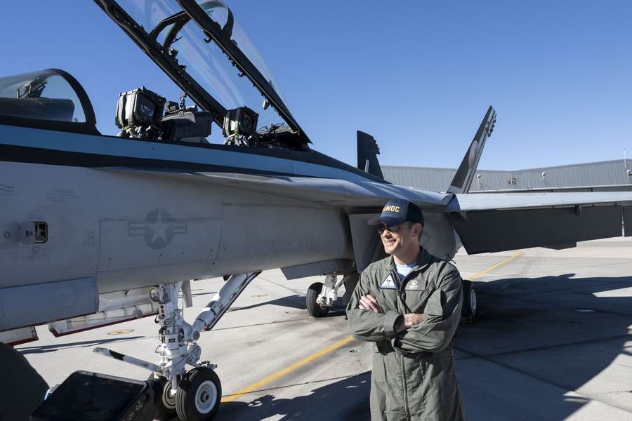 Defense Secretary Pete Hegseth standing beside an F/A-18 Super Hornet at Naval Air Station Fallon, Nevada