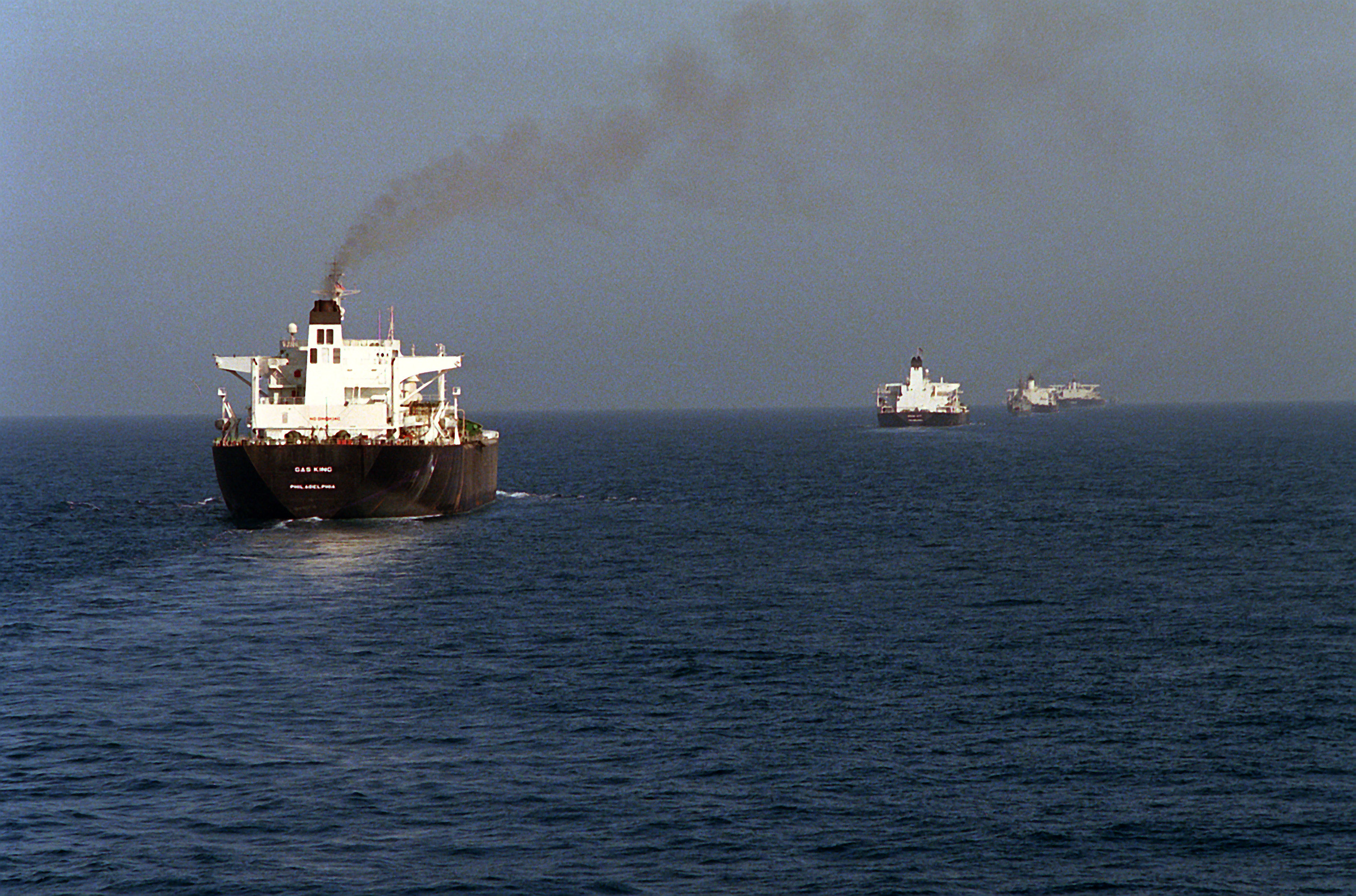 Reflagged supertankers sail in convoy through the Persian Gulf under escort during the Tanker War of the 1980s — file photo
