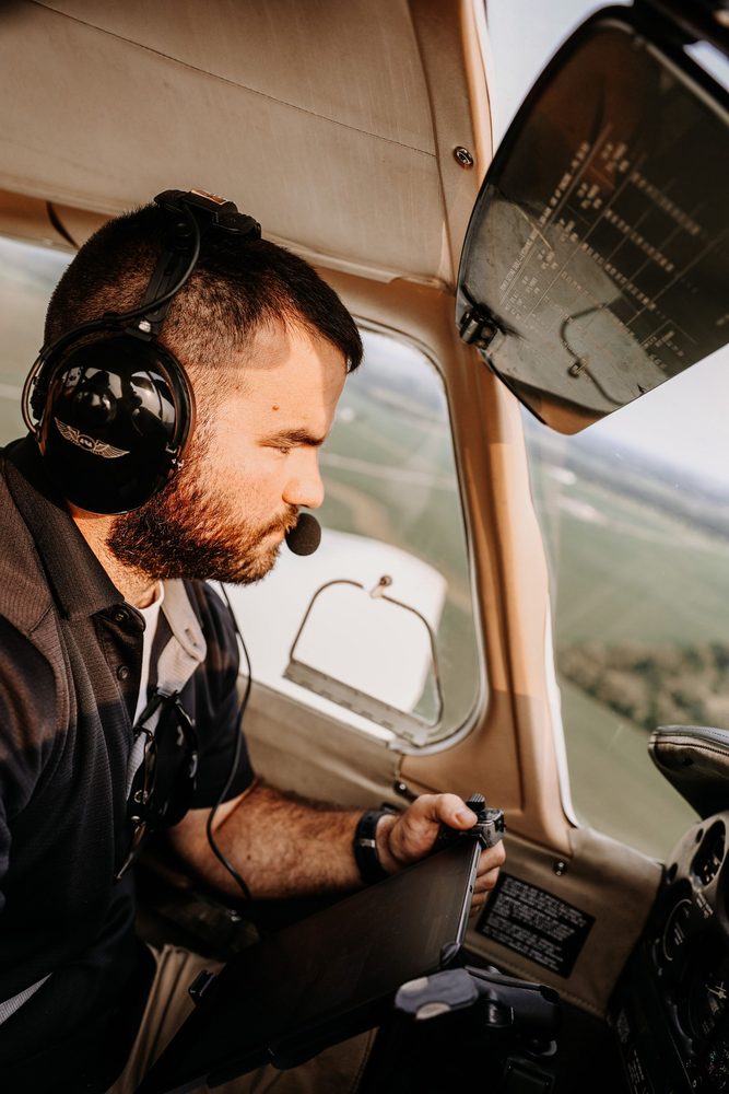 A pilot in the cockpit of a small aircraft &mdash; Robert Kelker-Kelly became a commercial pilot after leaving acting