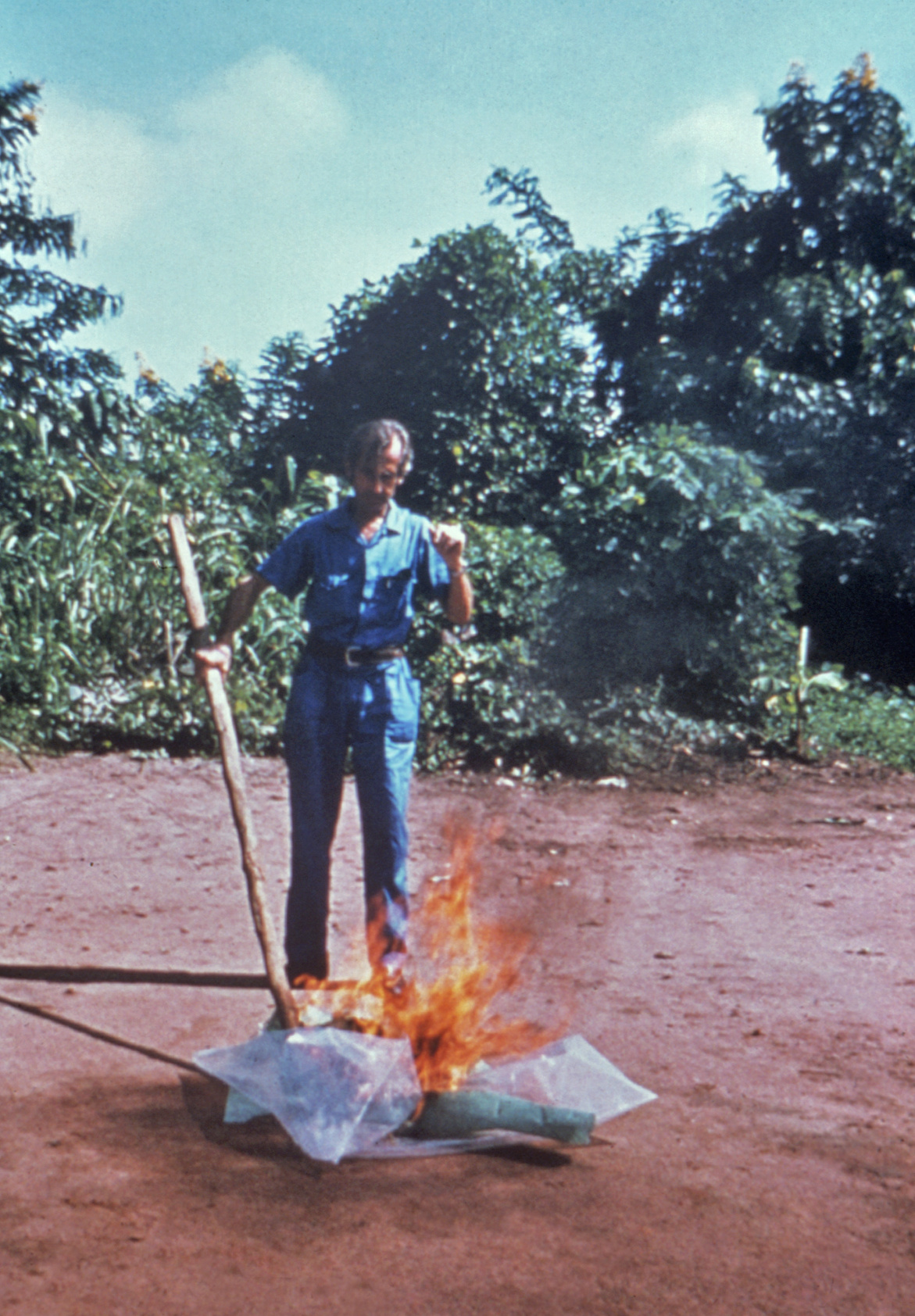 Kenya Ebola outbreak — a CDC worker incinerates medical waste from Ebola patients in Zaire, in a historic file photo of Ebola control