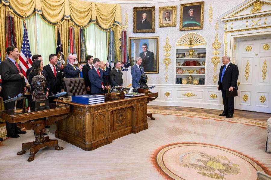 President Donald Trump stands in the Oval Office after signing an executive order in April 2026