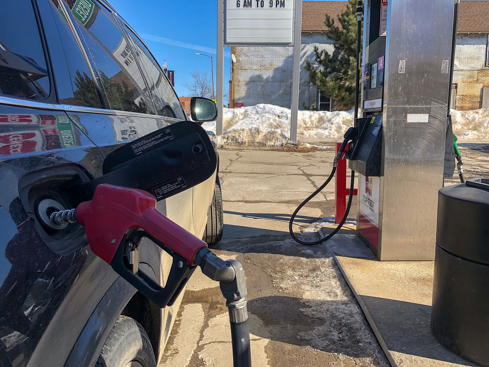 A driver fuels a car at a U.S. gas station — Iran war fuel prices have added an average of $471 to what American consumers pay, a CREA study finds