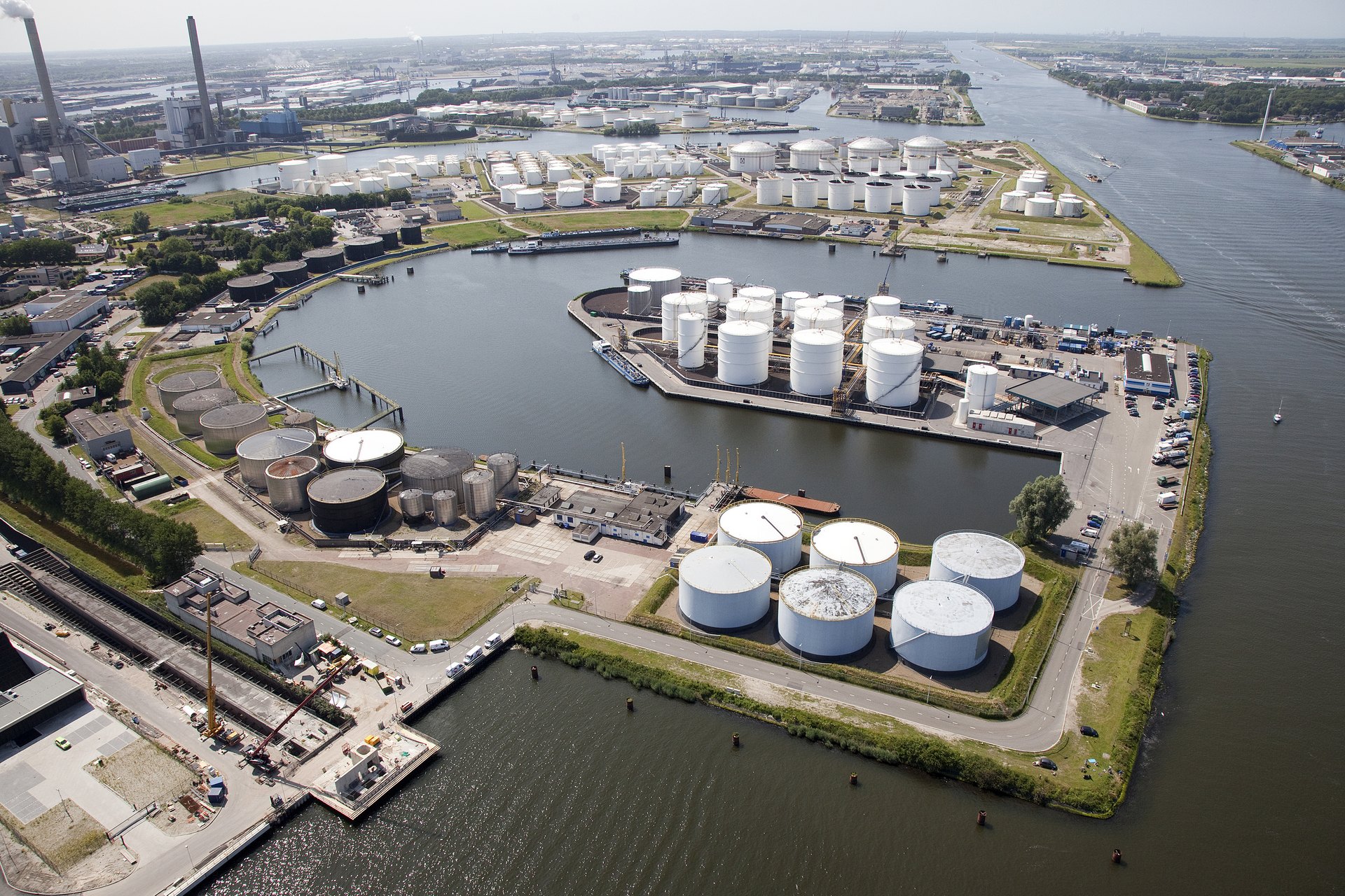 Oil storage tanks at Petroleumhaven in Amsterdam representing depleted global oil inventories
