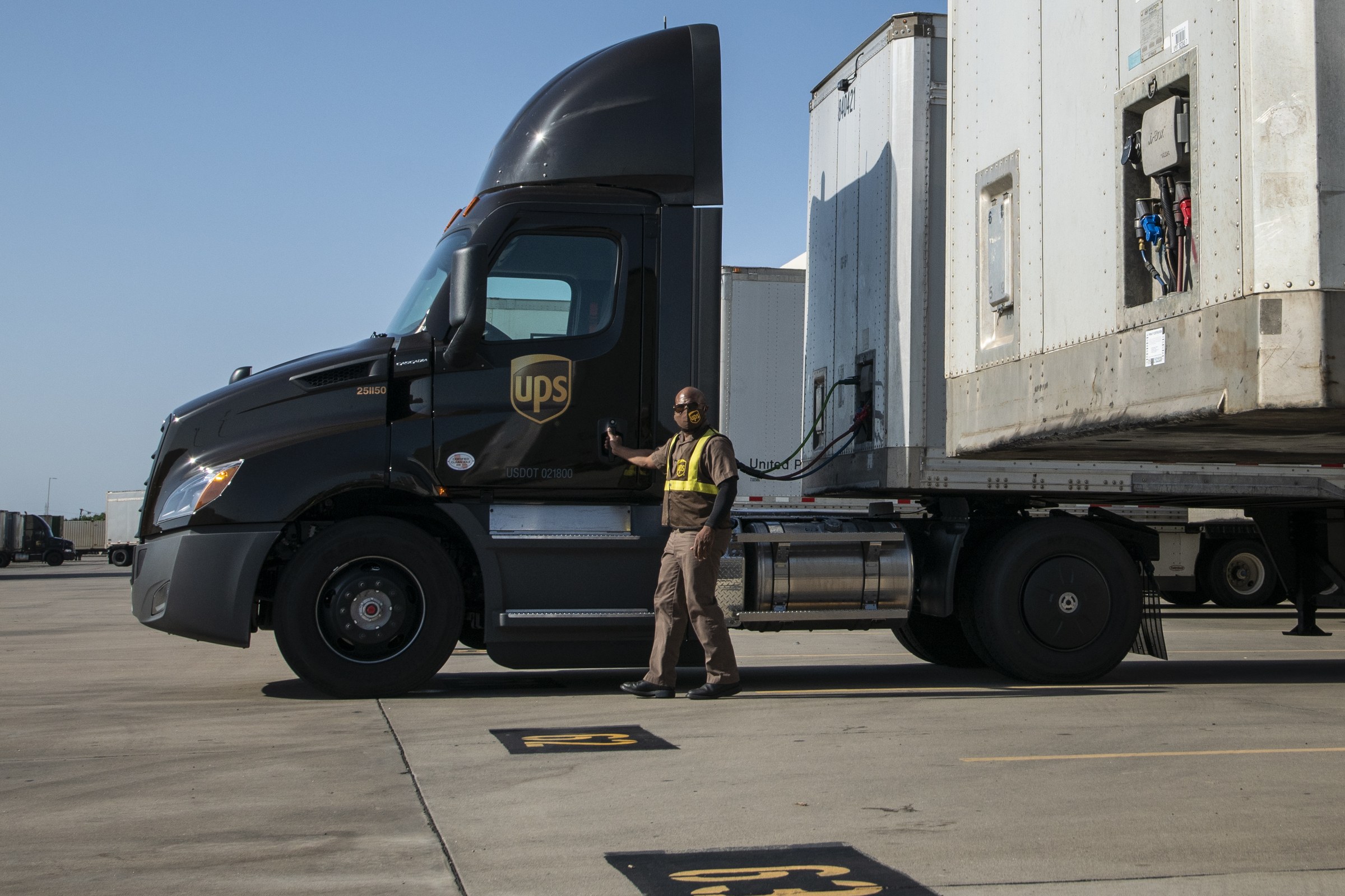 UPS highway diesel tractor and driver in Arlington, Texas, relevant to Trump trucker fuel savings