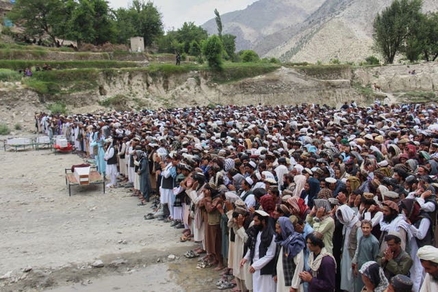 Mourners praying after earlier Pakistani airstrikes in eastern Afghanistan