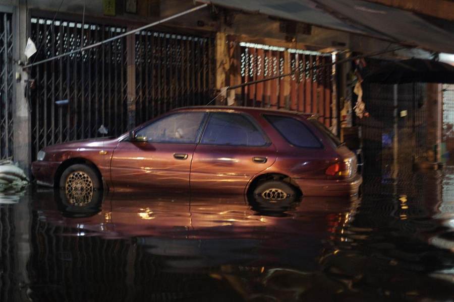 Car submerged in floodwater on a Bangkok street during the 2011 Thailand floods, file photo