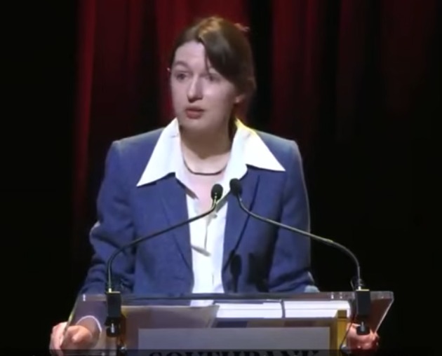 Sally Rooney speaking at a lectern at the Southbank Centre in London