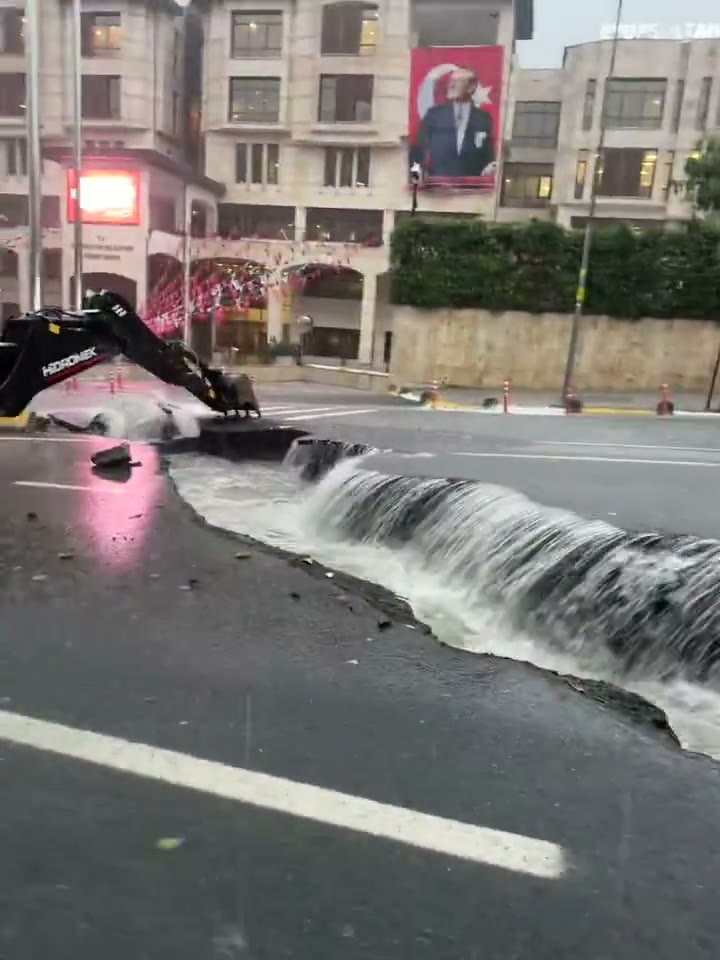 Floodwater surging across an Istanbul street during the October 14 flash floods