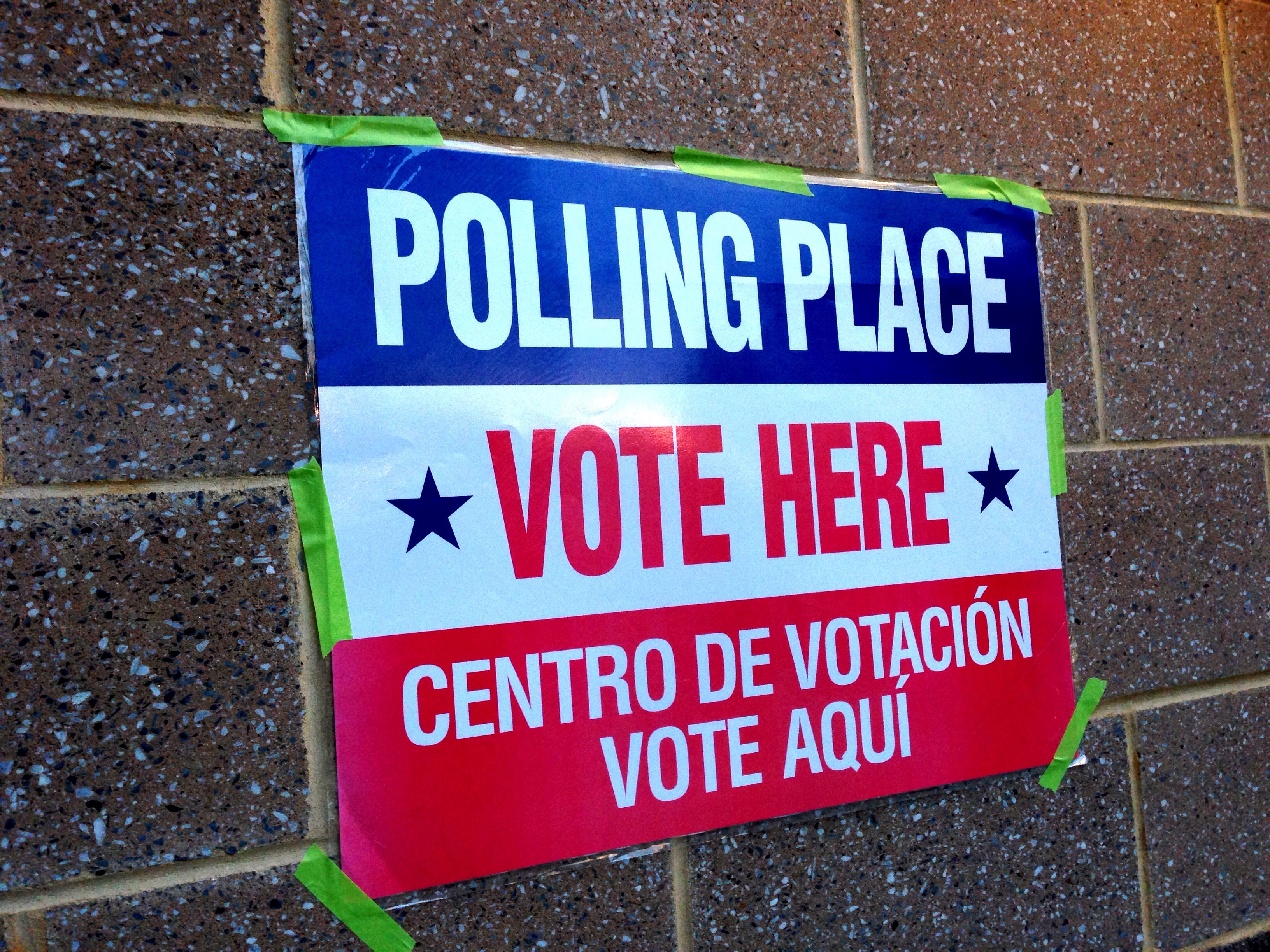 Trump approval rating today October 2026 — a Vote Here sign outside a U.S. polling place, file photo