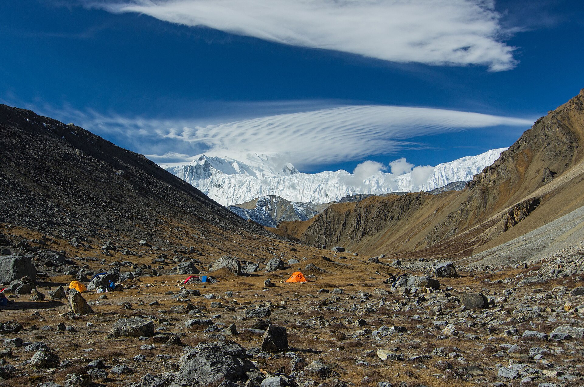 Climbers missing Himalayas October 2026 — a high base camp beneath a snow peak in Nepal's Manang district