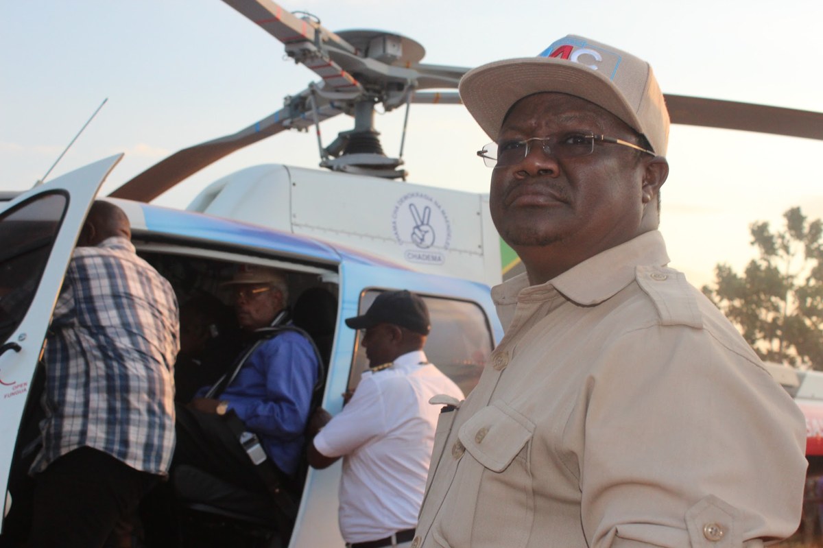 CHADEMA leader Tundu Lissu beside a party helicopter in a file photo — his party is demanding Kenya help find Twaha Mwaipaya