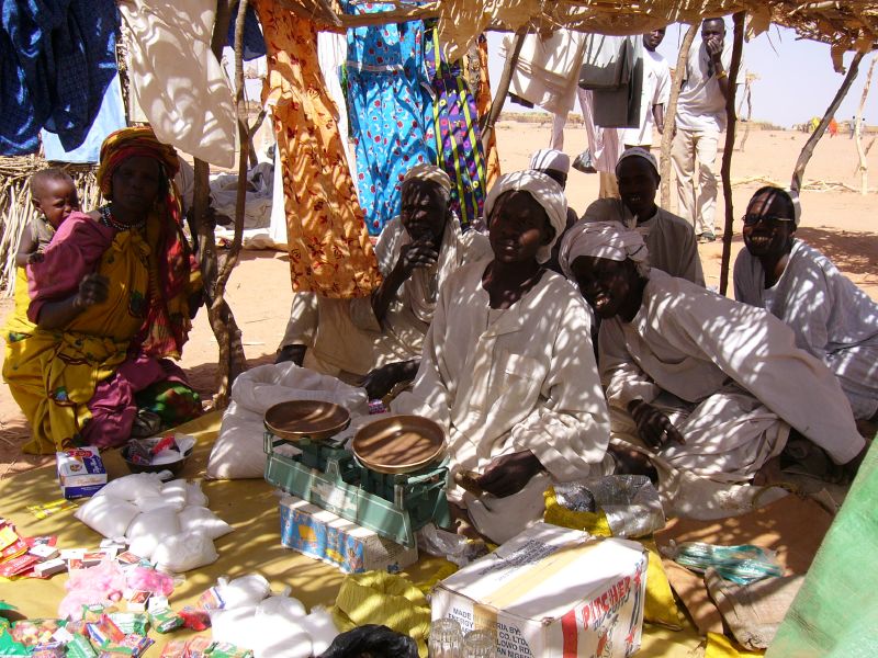 Sudan drone strikes 306 killed — men at a camp in Chad for people displaced from Darfur, in a file photo of Sudanese driven from their homes by the war