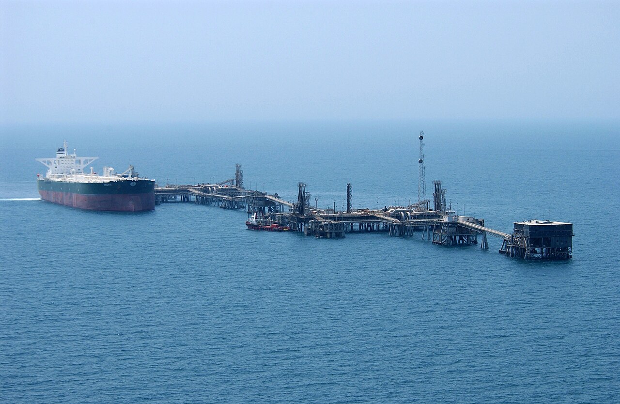 Commercial oil tanker AbQaiq at an Iraqi Gulf terminal, illustrating the shipping stakes in Strait of Hormuz reopening talks