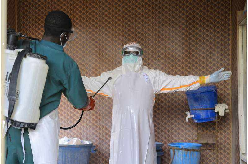 Health workers disinfect protective clothing at a Beni Ebola treatment center during the DRC Ebola outbreak 2026