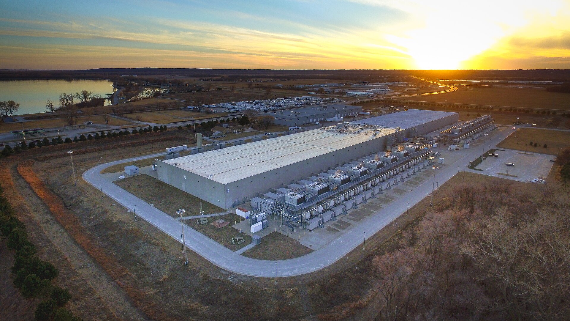 A large data centre at sunset in Council Bluffs, Iowa, illustrating the computing infrastructure behind the internal coding tests in the OpenAI agents weakened monitoring disclosure