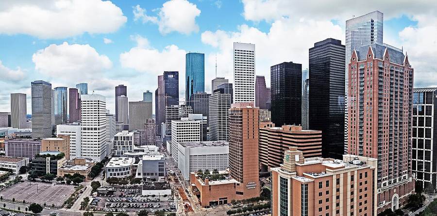 Downtown Houston skyline; the Texas Tribune identified ICE agent Gregory Feathers as the officer who fatally shot Lorenzo Salgado Araujo in the city's East End on July 7