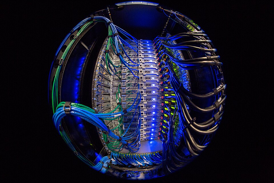 Server racks representing the multibillion-dollar compute behind open-weight AI models in 2026