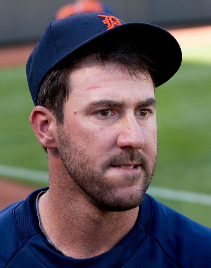 Justin Verlander pitching for the Detroit Tigers — the three-time Cy Young winner retired Saturday after 21 major-league seasons