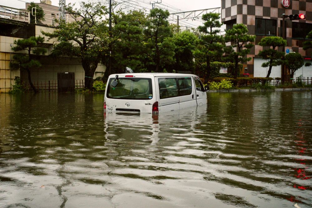 A van partly submerged in floodwater in Kamakura during Typhoon No. 15 in September 2025