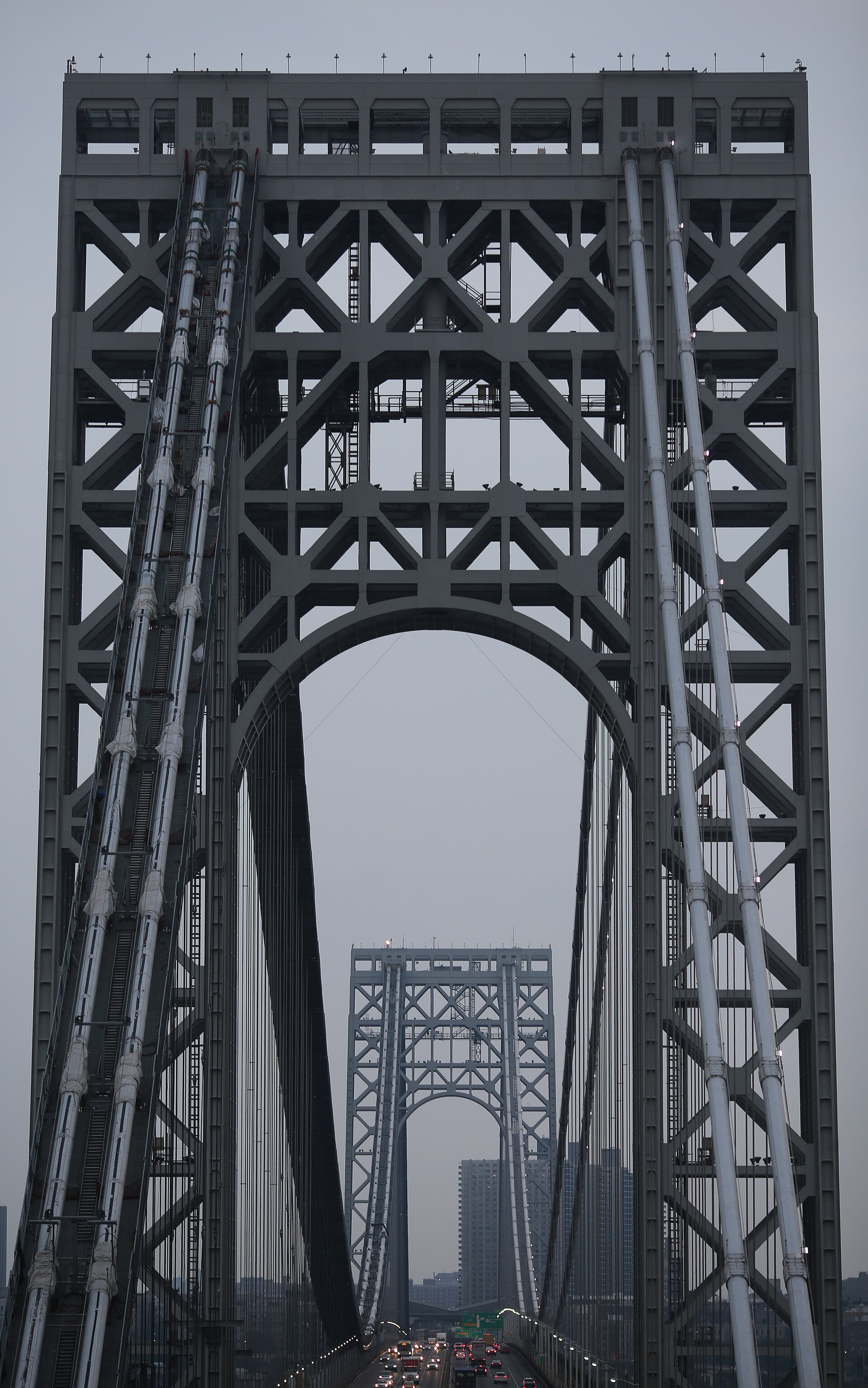 A tower of the George Washington Bridge at dusk with evening traffic below, near where the George Washington Bridge shooting happened