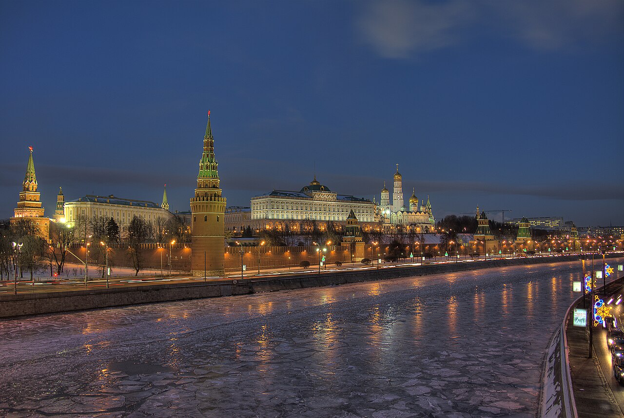The illuminated Moscow Kremlin beside the Moskva River at night