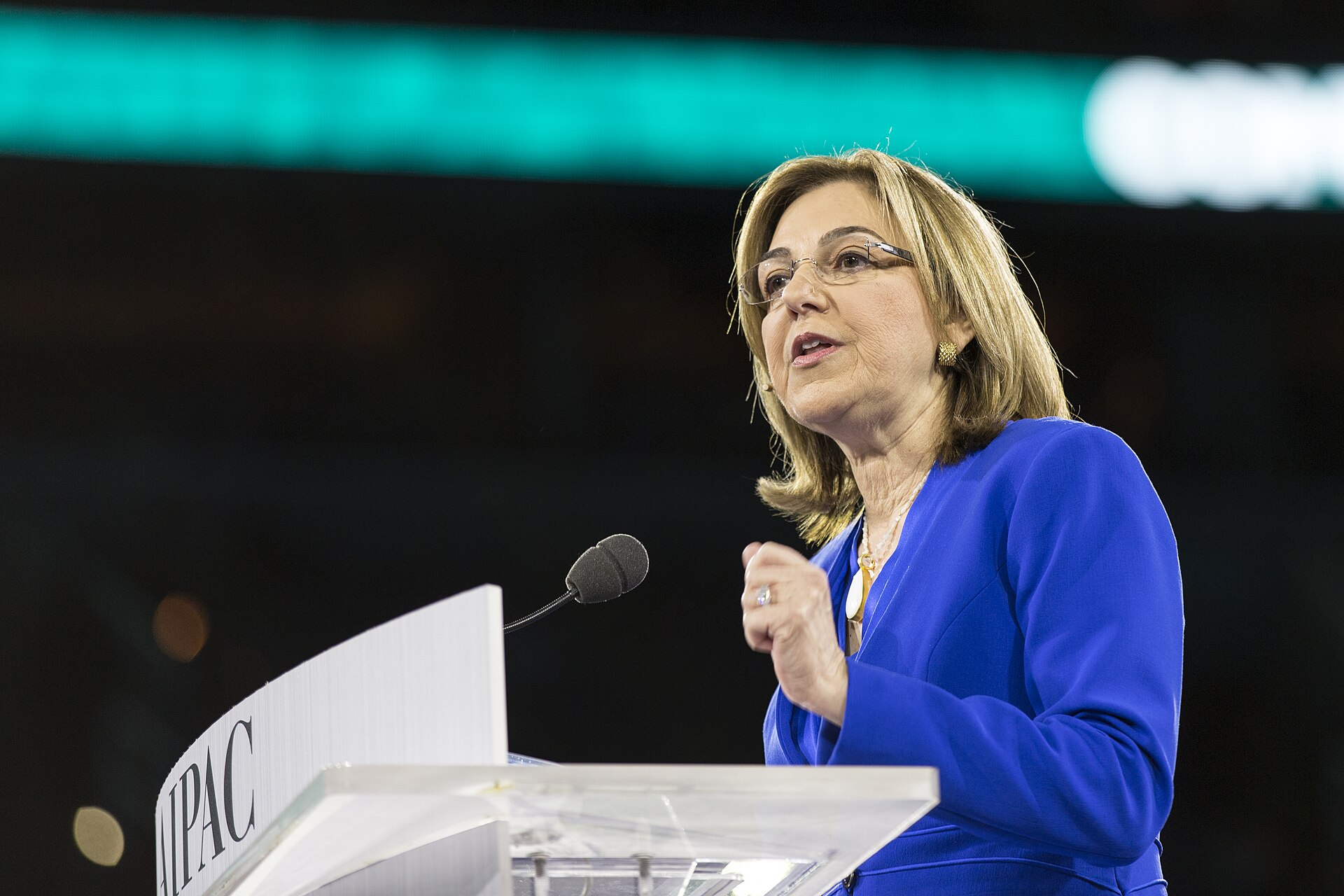 AIPAC ends candidate endorsements — a speaker at an AIPAC conference podium