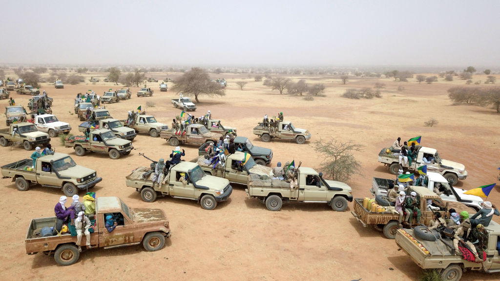 An aerial view of Tuareg armed-group vehicles moving across open ground in Mali
