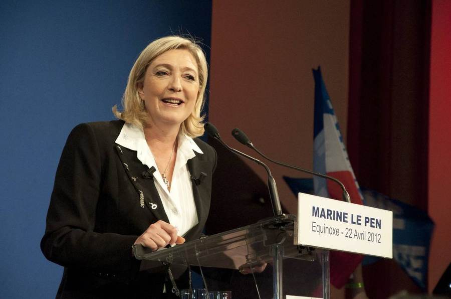 Marine Le Pen speaking at a rally; her National Rally won a record 14 French Senate seats in the September 2026 Senate elections