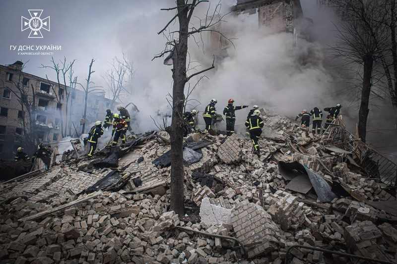 Kharkiv emergency crews search the rubble of a residential building after a Russian attack