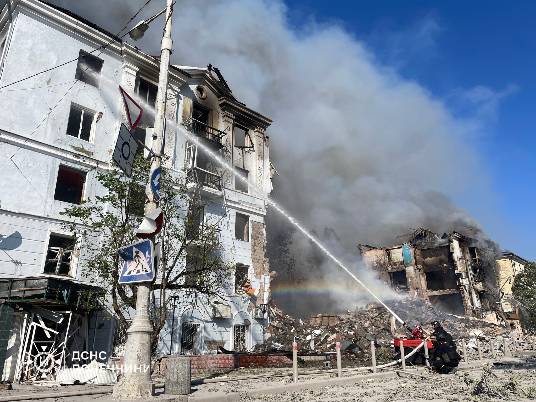 Firefighters spray water on a burning apartment building in Kramatorsk — Kramatorsk attack kills heating workers and four people in total on Tuesday