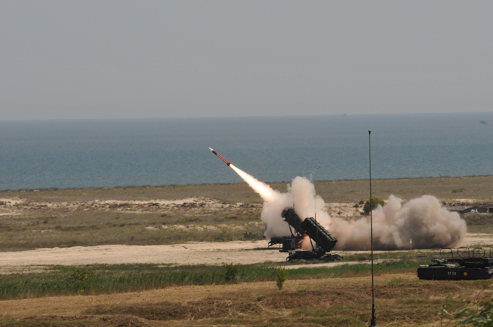 A US Army Patriot missile system fires an interceptor during a live-fire exercise — about 65% of the Patriot interceptor stockpile has been expended in the Iran war, according to Pentagon figures given to Congress