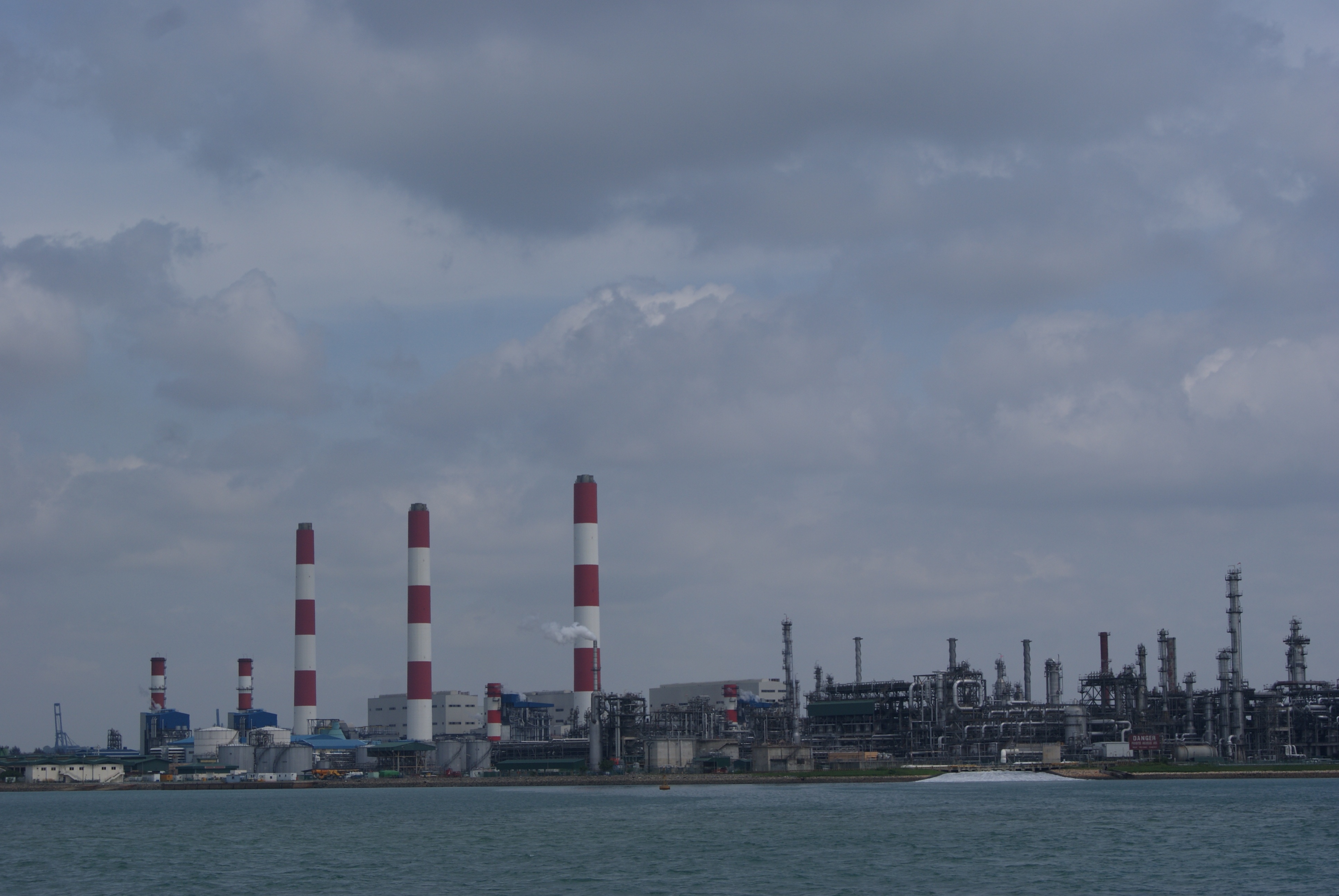 Jurong Island refinery shoreline in Singapore, near the Jurong Rock Caverns where Saudi crude storage is planned