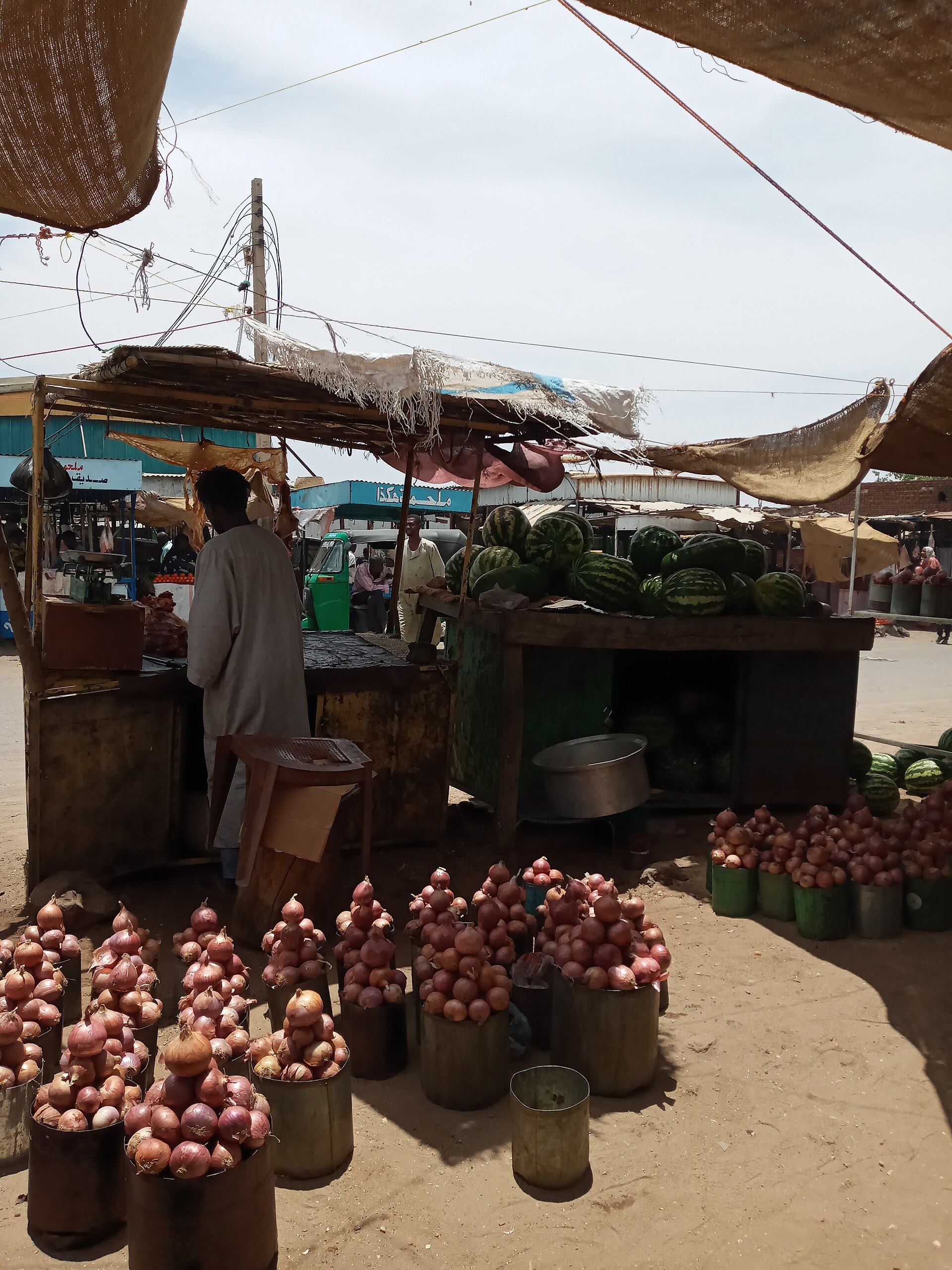 Onions and watermelons at a produce stall in a Nyala market, in a file photograph — a market like this one is where the Nyala market drone strike casualties had gathered on Oct. 26