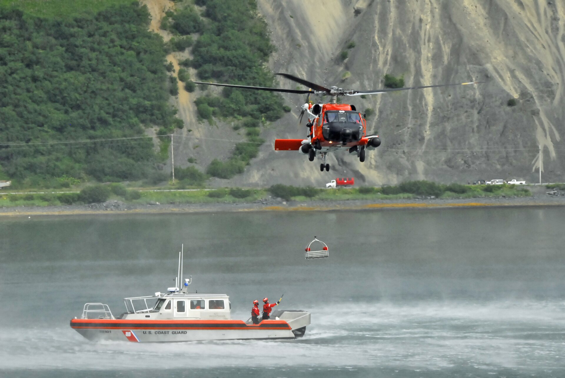 U.S. Coast Guard MH-60 Jayhawk helicopter conducting a rescue hoist over the ocean during a Coast Guard rescue Ensenada file photograph
