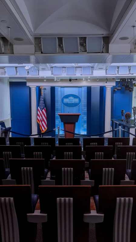 Empty White House press briefing room podium awaiting Katie Zacharia’s first briefing