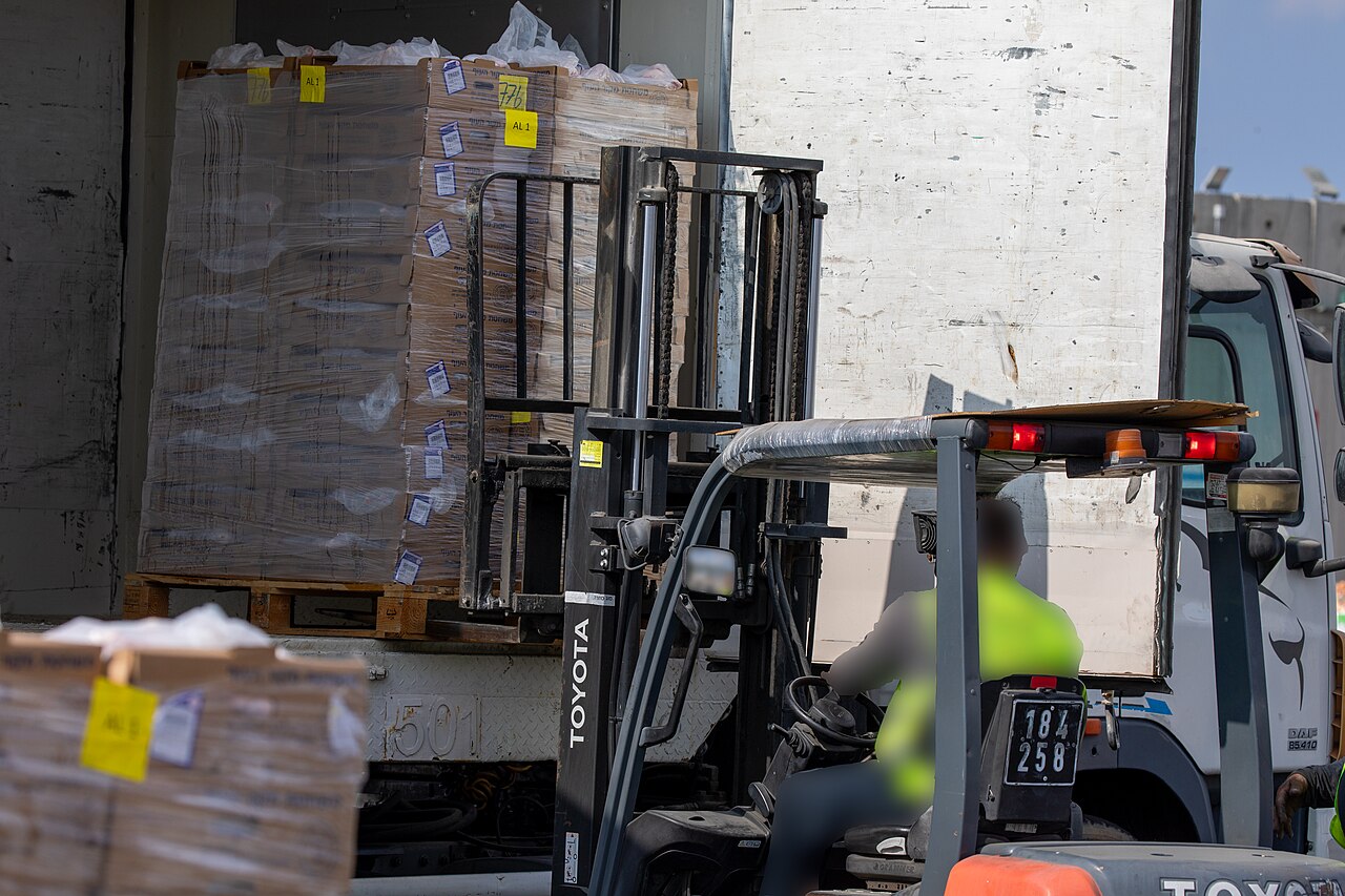 Humanitarian aid pallets staged at the Kerem Shalom crossing into Gaza — Israel closes Gaza crossings October 7 anniversary with no aid entering during the closure
