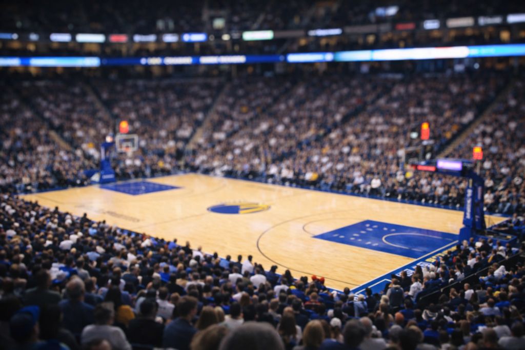 Packed NBA arena during a game under bright lights — NBA Cup opening night 2026 coverage