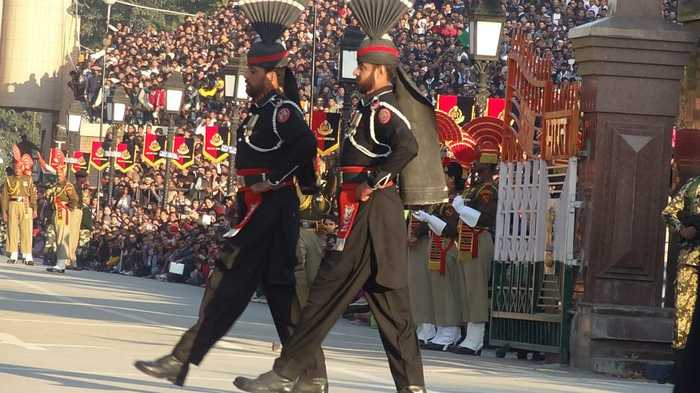 Pakistan Rangers marching at the Wagah border ceremony as a crowd watches