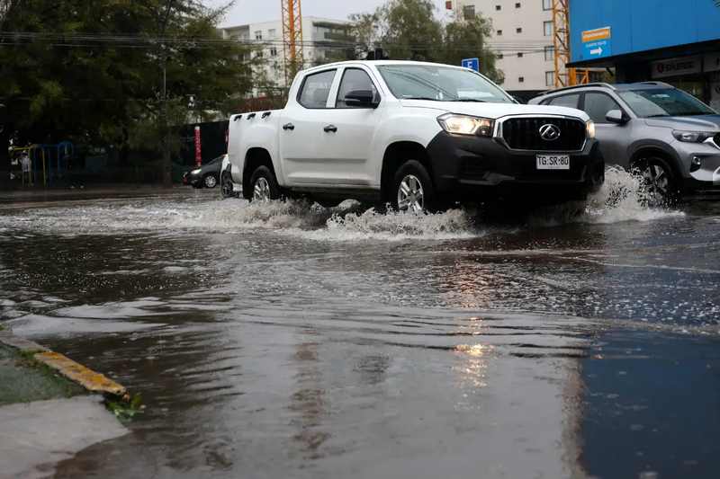 Pickup truck moving through deep water during the Santiago flash flood mudslide emergency