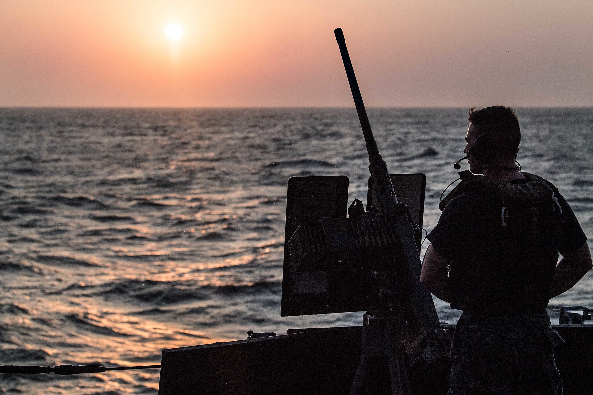 A US Navy sailor aboard the destroyer USS Jason Dunham in the Bab al-Mandeb strait between Djibouti and Yemen — the chokepoint beyond the Yemen fighting cuts off aid 800000 crisis