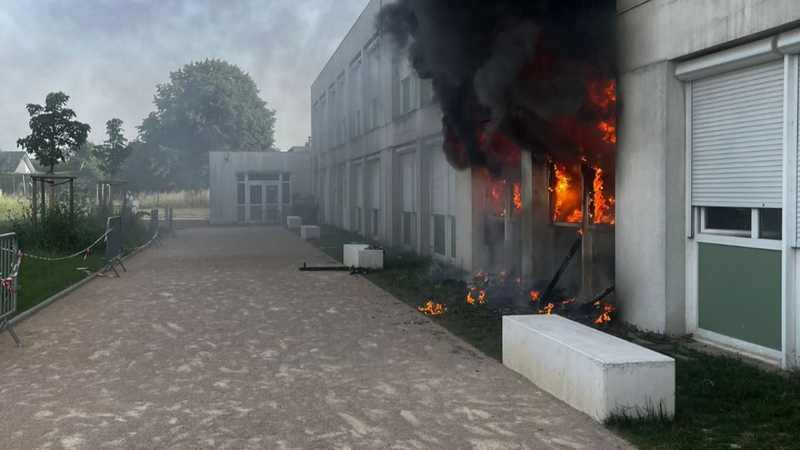 A school building burns in France — scenes like this played out in Metz during the October 2026 student riots