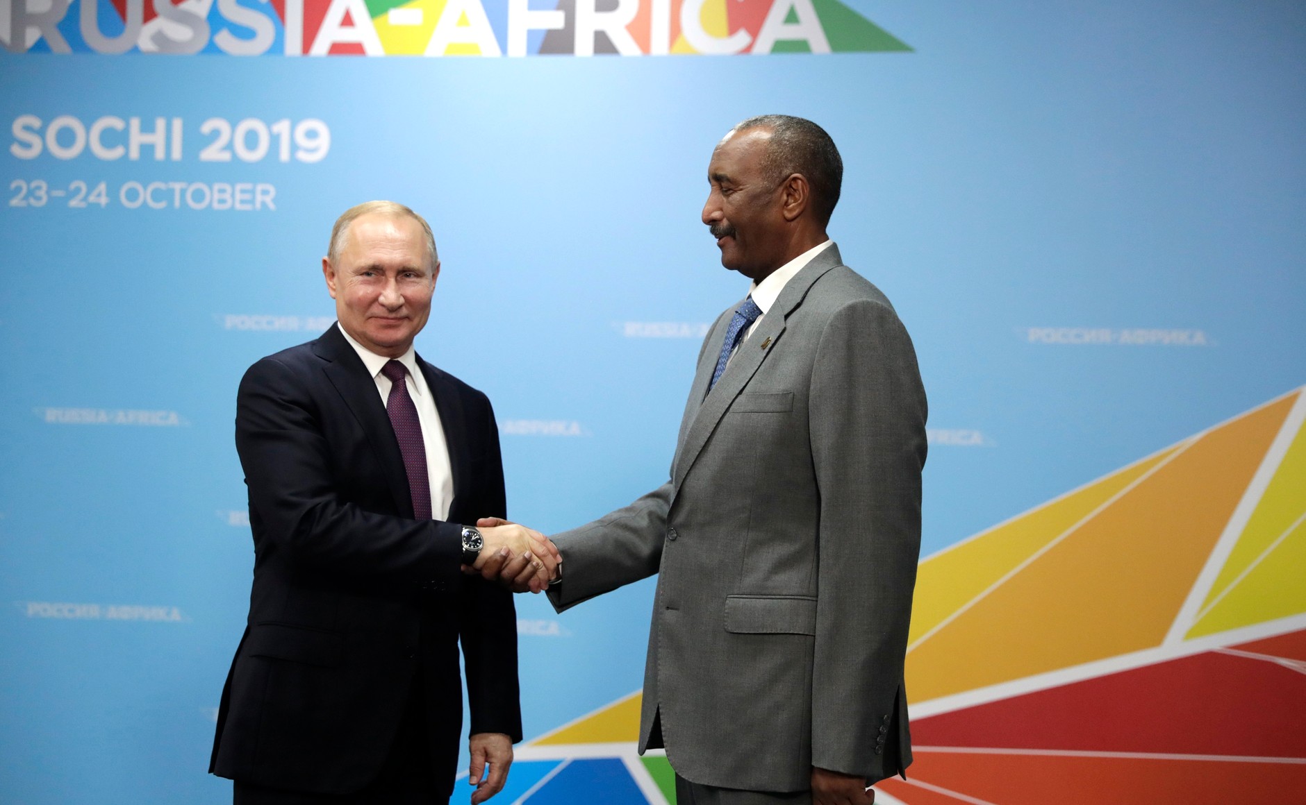 Vladimir Putin shakes hands with Abdel Fattah al-Burhan at the Russia-Africa Summit in Sochi in October 2019 — Putin Burhan Sudan ceasefire talks