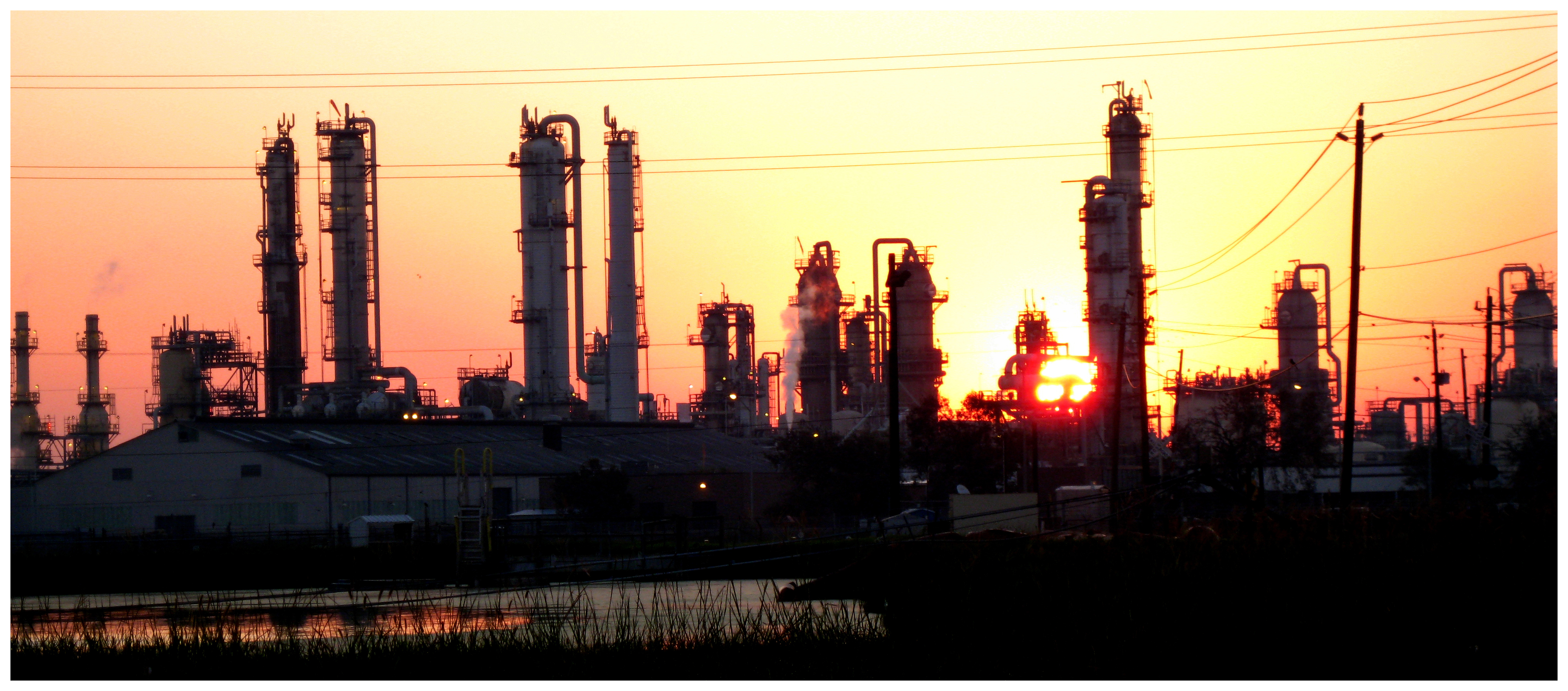 ExxonMobil's Baytown refinery in Texas at sunrise — Exxon Chevron third quarter earnings beat forecasts as refining profits overtook upstream at Exxon for the first time in at least six years
