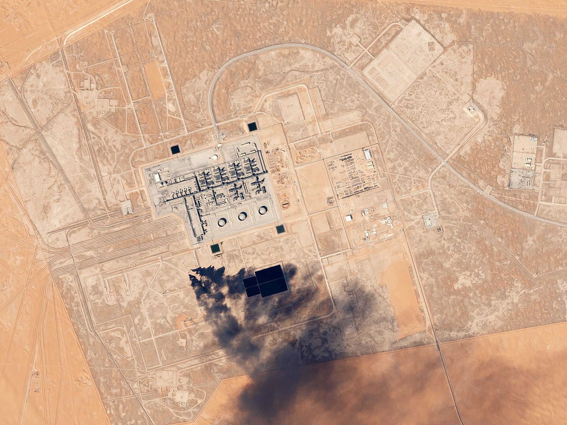 Satellite view of an Aramco oil processing facility in the Saudi desert, illustrating the exposure of Eastern Province energy infrastructure