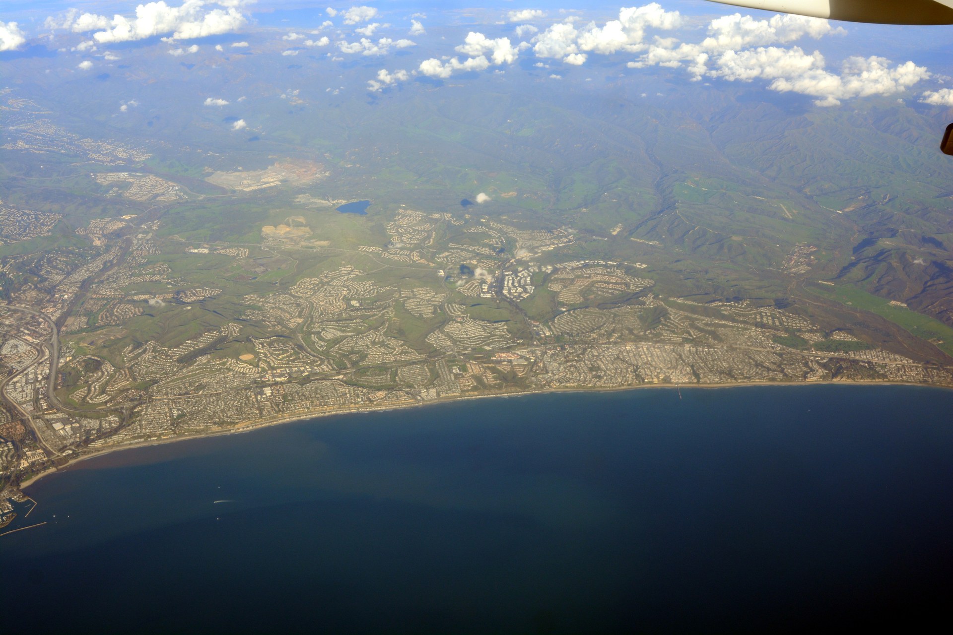 Aerial file photograph of San Clemente, California, showing neighbourhoods running from the coast into brush-covered hills