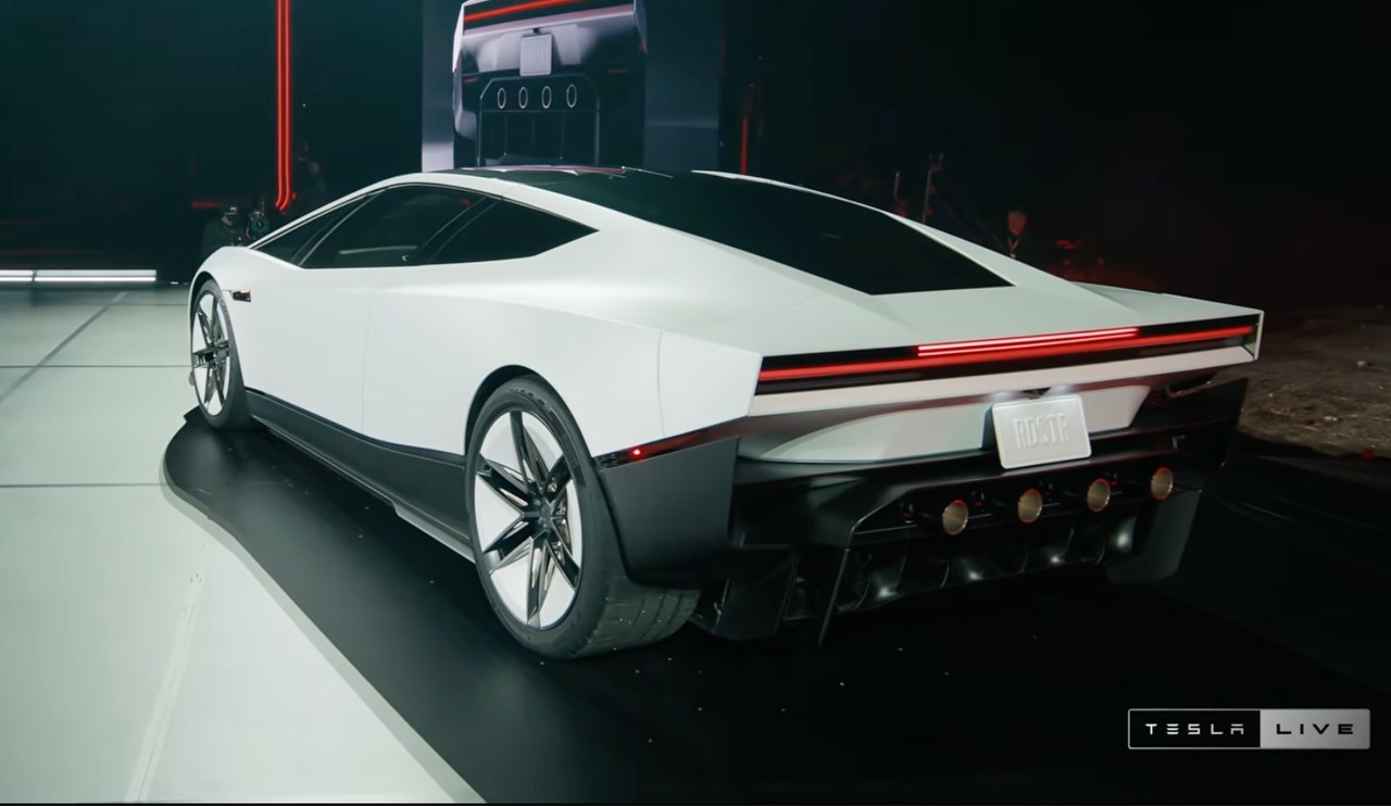 The redesigned Tesla Roadster on stage at McGregor, Texas, showing its angular rear styling and thruster nozzles