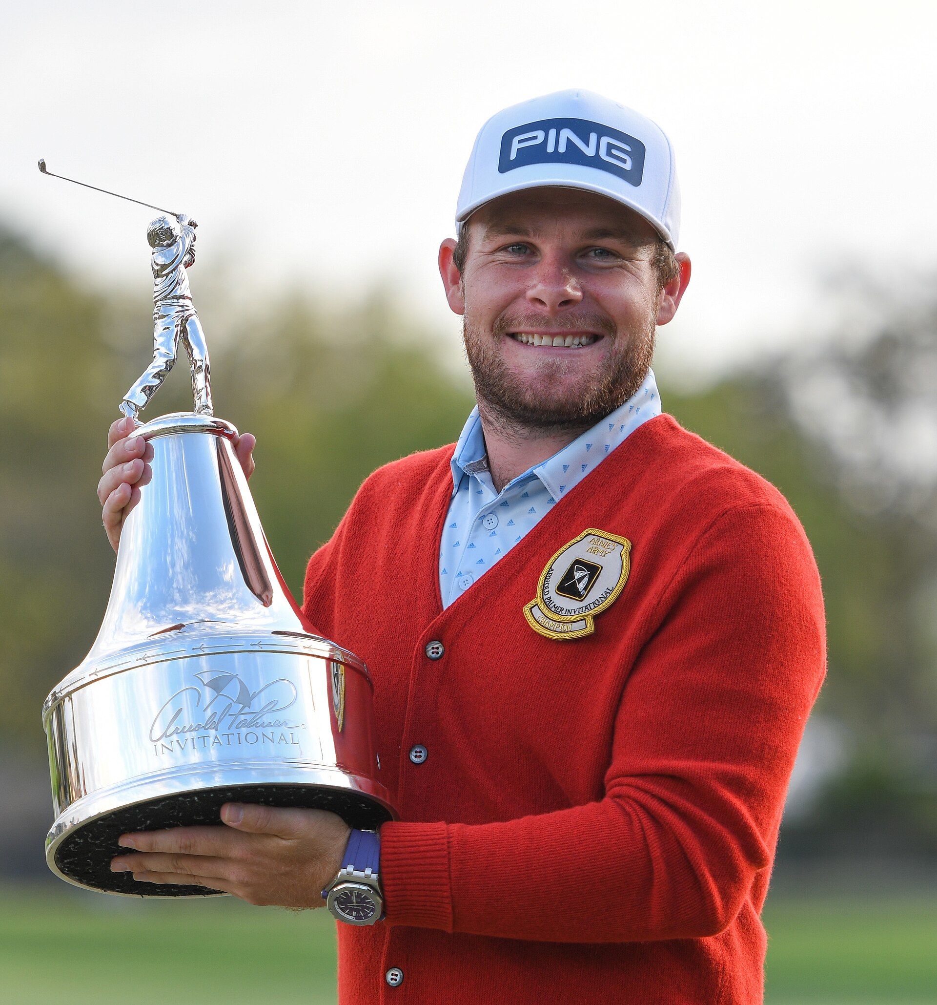 LIV Golf players leaving — Tyrrell Hatton holding the Arnold Palmer Invitational trophy